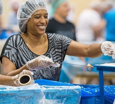 Woman Handing out food